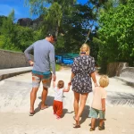 Family walking together on a tropical island during travel and remote work lifestyle
