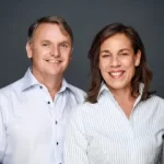 Gary and Claudia Castle smiling in a professional portrait for an Expert English testimonial